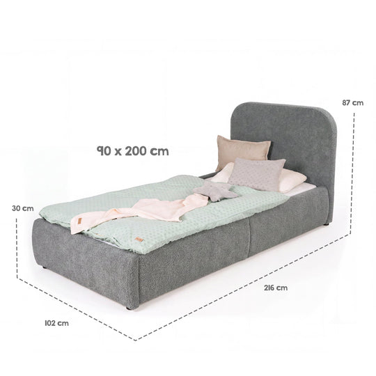 Gráfico de medidas de la cama infantil gris: superficie de descanso 90×200 cm, medidas totales 216×102×87 cm, arcón 30 cm.