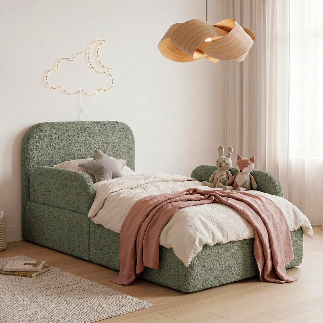Green bouclé children's bed with fall protection, cuddly toys and moon-and-cloud fairy lights. Fully AI-generated.