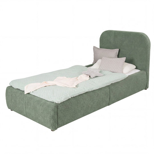 Green bouclé children's bed with fall protection, mint bed linen, cut-out image.