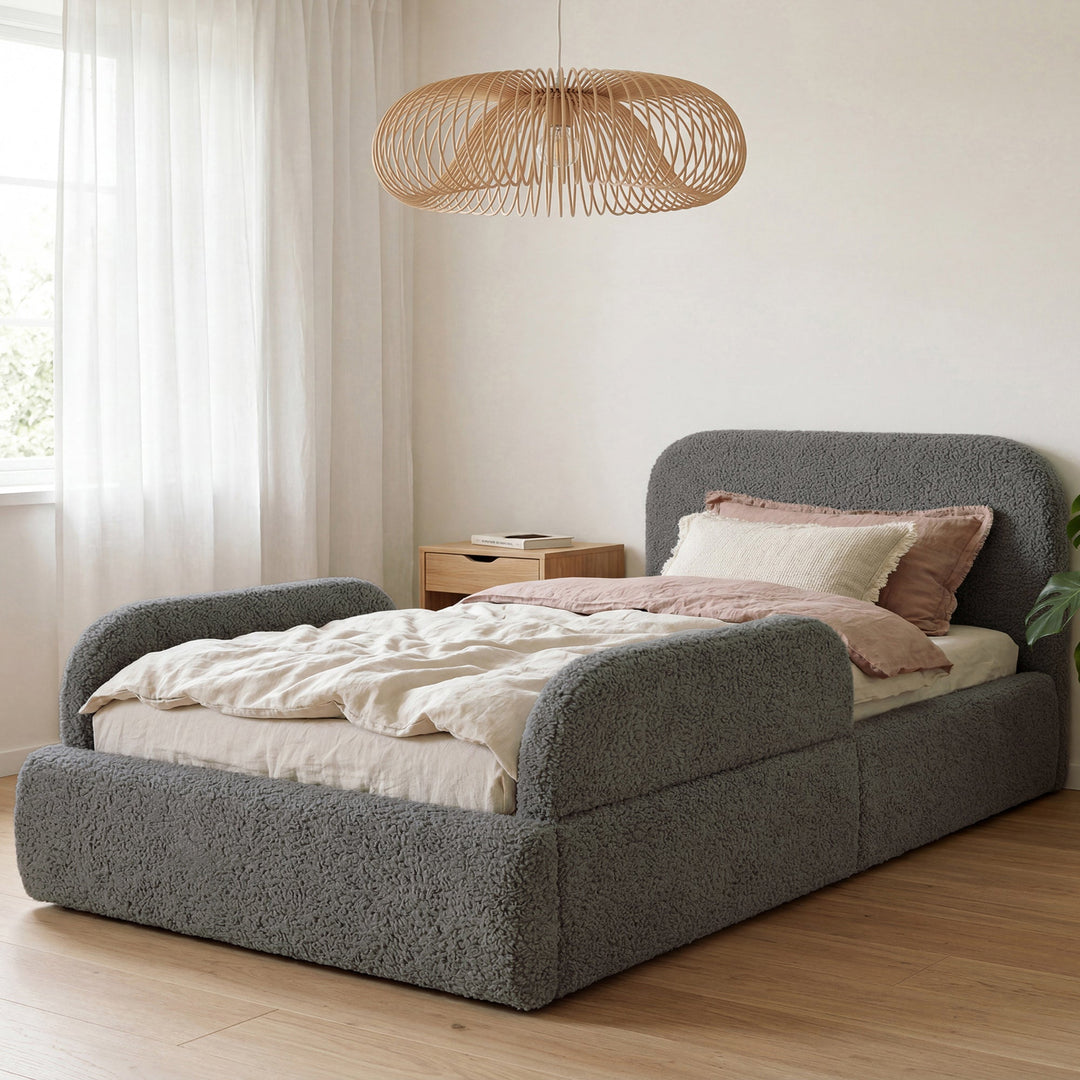 Grey bouclé bed with rattan pendant lamp and pink bed linen in the room. Fully AI-generated.