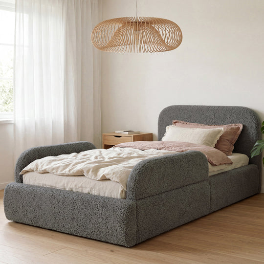 Grey bouclé bed with rattan pendant lamp and pink bed linen in the room. Fully AI-generated.