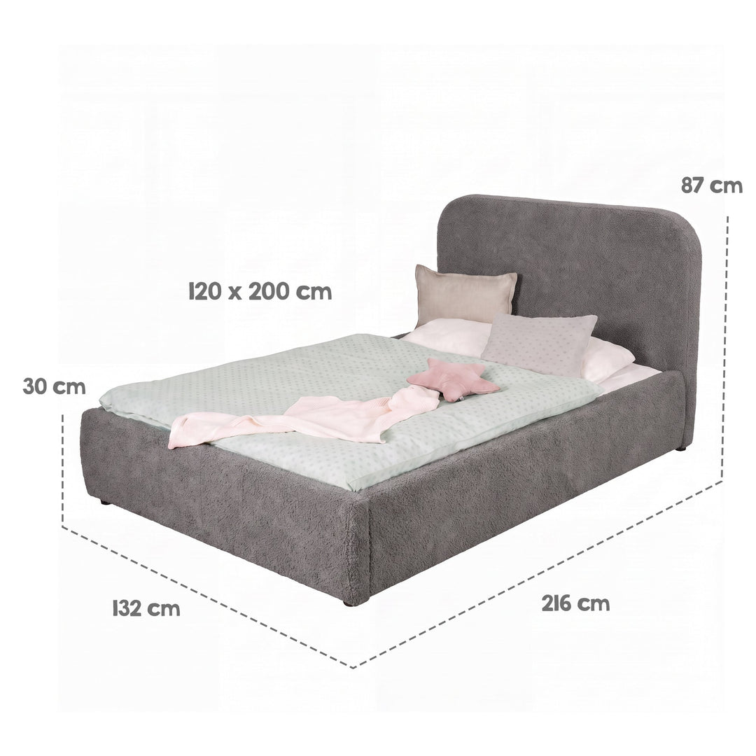 Dimension graphic of the grey bed with bed linen: sleeping surface 120×200 cm, overall dimensions 216×132×87 cm.