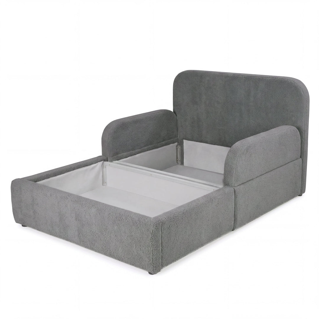 Cama infantil roba Little Dream antracita con el arcón abierto y espacio de almacenaje bajo la superficie de descanso. Generada parcialmente con IA.