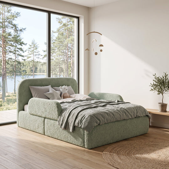 Sage green roba Little Dream children's bed in a children's room with lake view, mobile and small olive tree. Partially AI-generated.