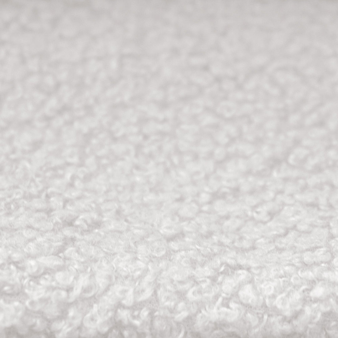Close-up of the white bouclé fabric cover of the roba Little Dream children's bed.