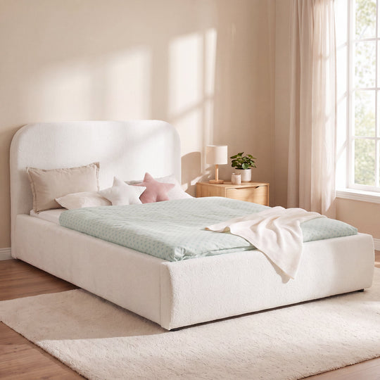 White roba Little Dream children's bed in a bright bedroom with bedside table and reading lamp. Partially AI-generated.